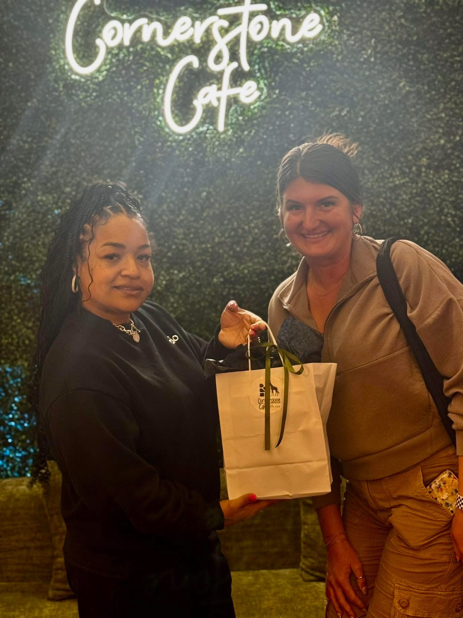 Owner Shante Lowe sharing a moment with a happy customer